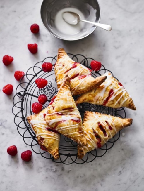 Raspberry and apple hand pies with lemon drizzle