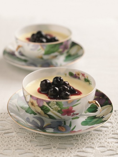 Lemon posset with warmed blueberries